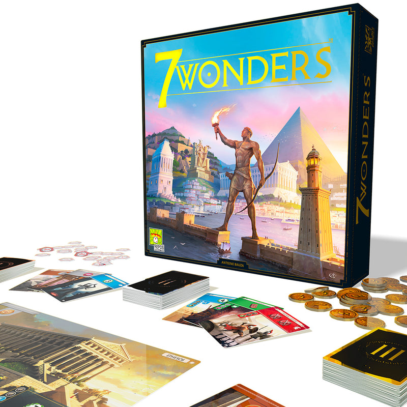 7 Wonders box lid. Statue with torch stands in front of Egyptian city and pyramid. Game pieces and cards